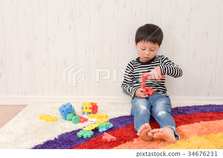Boys playing in the room 34676231