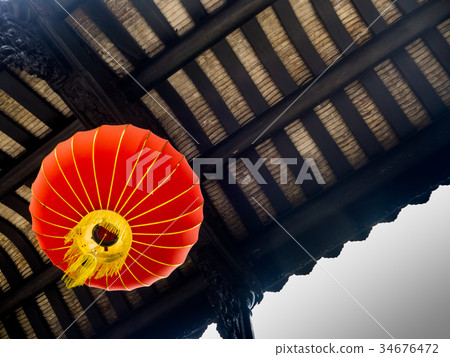 Typical red Chinese lantern hanging outside, China Typical red Chinese lantern hanging outside, China 34676472
