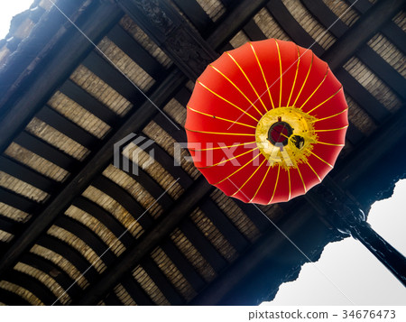 Typical red Chinese lantern hanging outside, China Typical red Chinese lantern hanging outside, China 34676473