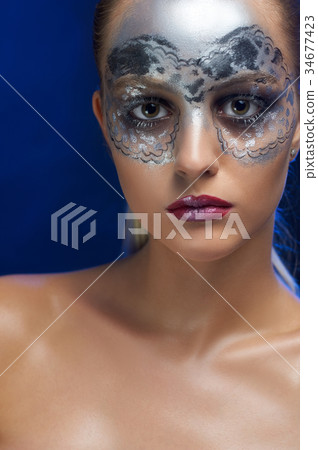 Model with make-up in silver tones Model with make-up in silver tones 34677423