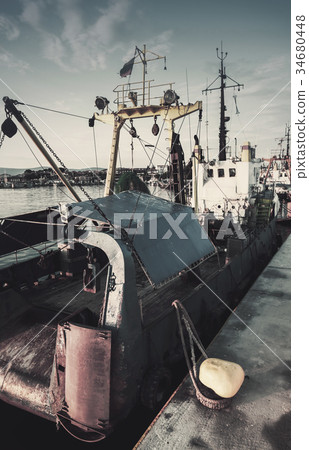 Industrial fishing boats are moored in port Industrial fishing boats are moored in port 34680448