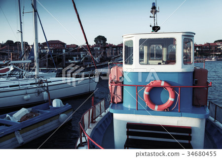 Fishing boats are moored in port Fishing boats are moored in port 34680455