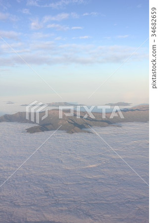 Aerial view of the Andes Mountains floating in the sea of spring and morning cloud in central South America Chile Aerial view of the Andes Mountains floating in the sea of spring and morning cloud in central South America Chile 34682659