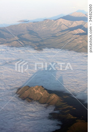 Aerial view of the Andes Mountains floating in the sea of spring and morning cloud in central South America Chile 34682660