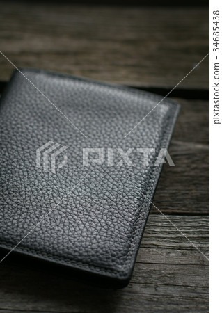Black wallet on wooden board. Black wallet on wooden board. 34685438