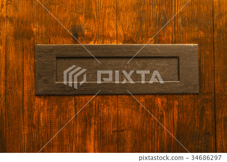 Old letterbox in the door 34686297