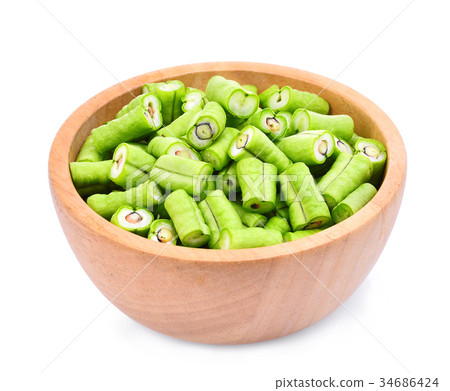 slice of yard long bean in wooden bowl isolated  34686424