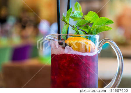 Currant ice lemonade on table in cafe. Currant ice lemonade on table in cafe. 34687400