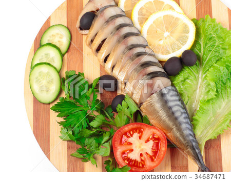 sliced herring on wooden plate 34687471