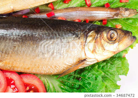 fish on plate with red pepper 34687472