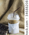 Iced coffee with beans. 34688208