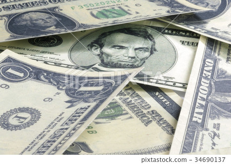 The dollar bill lined up. On a white background 34690137