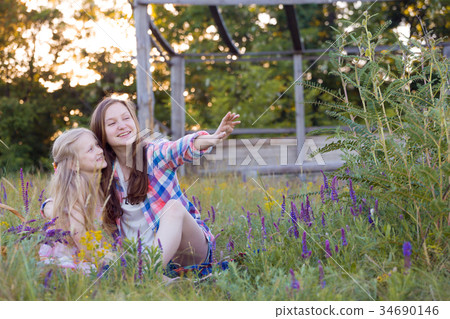 Beautiful girl on the meadow Beautiful girl on the meadow 34690146