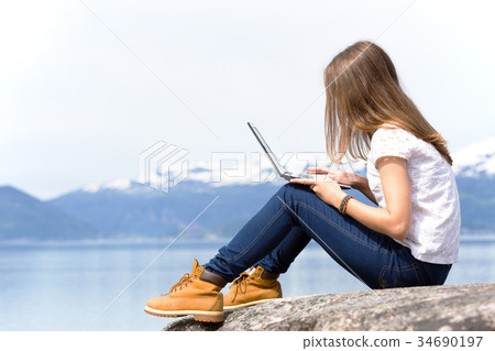 girl hiker with a laptop girl hiker with a laptop 34690197