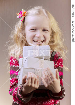 girl holding presents in hands girl holding presents in hands 34690201