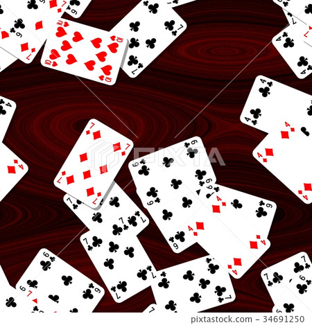 playing cards scattered on mahogany wooden table 34691250