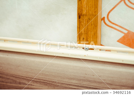 installation of siding on the facade of the house 34692116