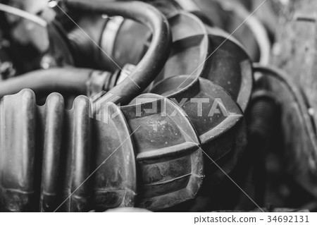 A close up shot of car engine hoses 34692131
