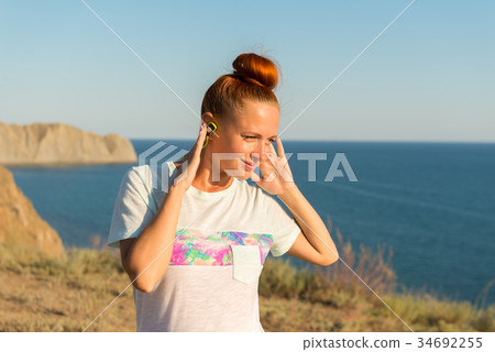 Fitness girl with wireless headphones 34692255