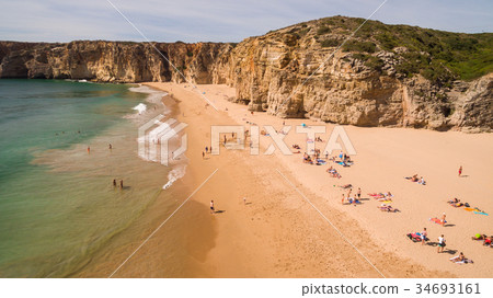 Aerial view of people resting on Beliche beach Aerial view of people resting on Beliche beach 34693161