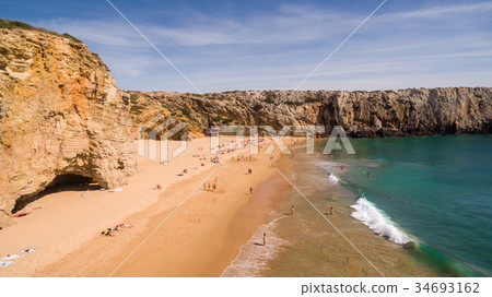 Aerial view of people resting on Beliche beach Aerial view of people resting on Beliche beach 34693162