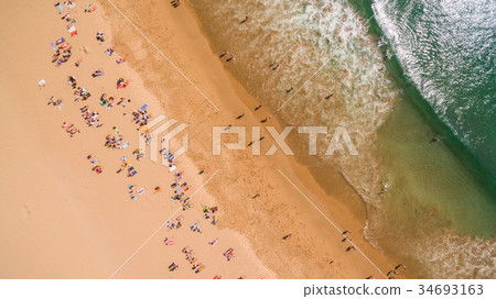 Aerial view of people resting on a beautiful beach 34693163