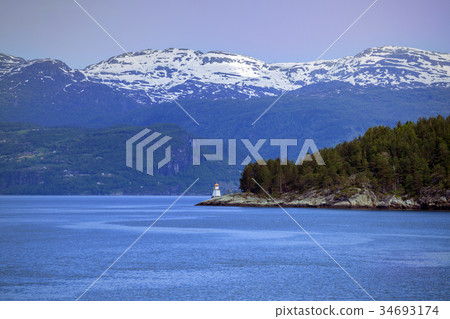 lighthouse on a fjord shore 34693174