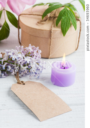 Kraft gift box, peonies and lilac flowers Kraft gift box, peonies and lilac flowers 34693960