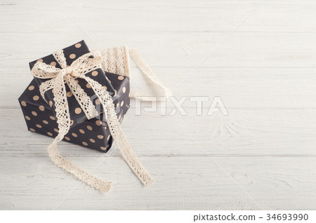 Gift boxes and lace ribbon Gift boxes and lace ribbon 34693990