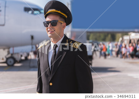 Hilarious airman near big plane Hilarious airman near big plane 34694311