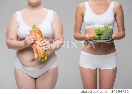 Thick and fit women eating healthy and unhealthy 34694785