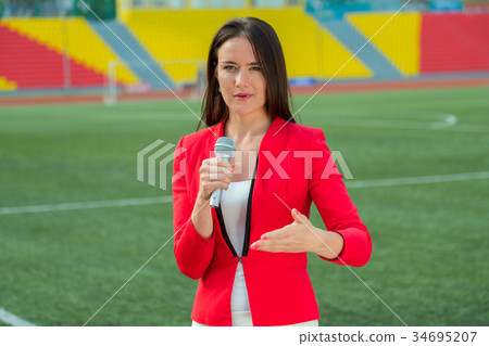 Young girl TV reporter is broadcasting 34695207