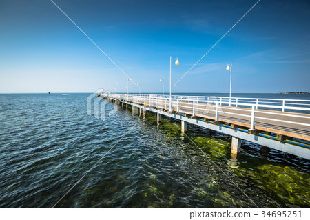 Wooden pier in Jurata town on coast of Baltic Sea Wooden pier in Jurata town on coast of Baltic Sea 34695251