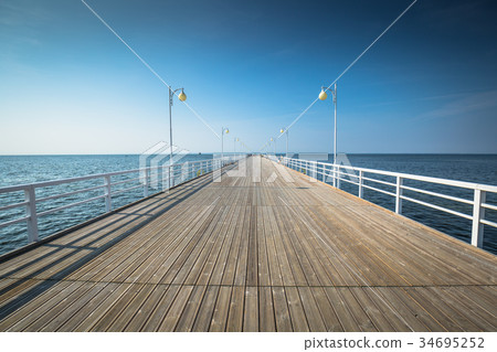 Wooden pier in Jurata town on coast of Baltic Sea 34695252