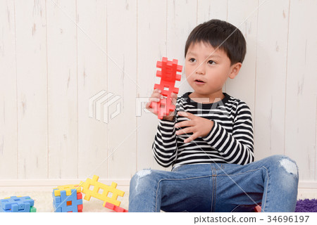 Boys playing in the room 34696197