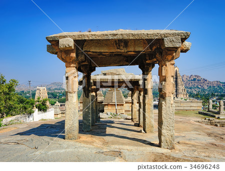 Ancient ruins on Hemakuta hill, Hampi, India Ancient ruins on Hemakuta hill, Hampi, India 34696248