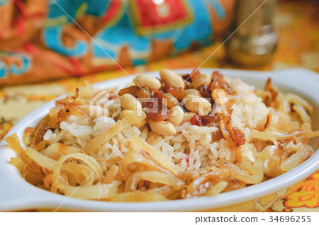 Pulao with ghee fried nuts and caramelized onions 34696255