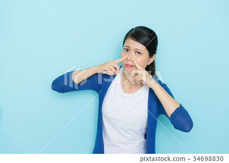elegant young girl using hands pressed nose 34698830