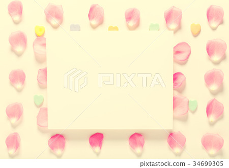 Rose petals and blank white card Rose petals and blank white card 34699305