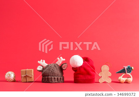 Knit winter hats on red Knit winter hats on red 34699372