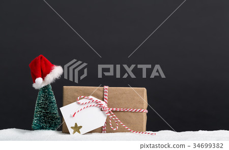 Gift box with miniature Christmas tree 34699382
