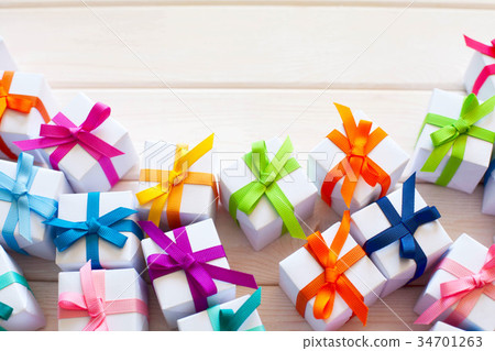 A lot of small gifts with color ribbons. 34701263