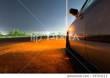 Auto near highway at night 34703213