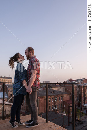 Date night on roof. Couple tender relationships 34703248