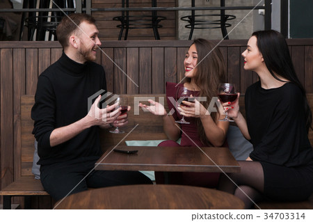 Joyful company conversation in bar Joyful company conversation in bar 34703314