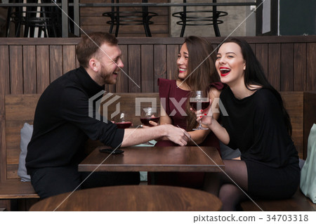 Funny company conversation in bar Funny company conversation in bar 34703318