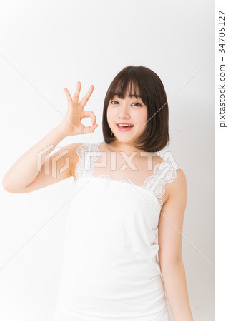 Young woman doing ok sign Young woman doing ok sign 34705127