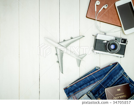 Hipster travel accessories on white woodentop view Hipster travel accessories on white woodentop view 34705857