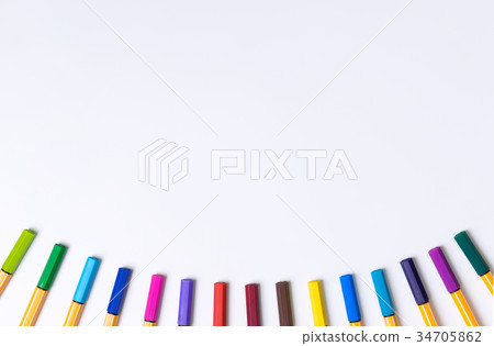 Color pens lying in curve line on white copy space Color pens lying in curve line on white copy space 34705862