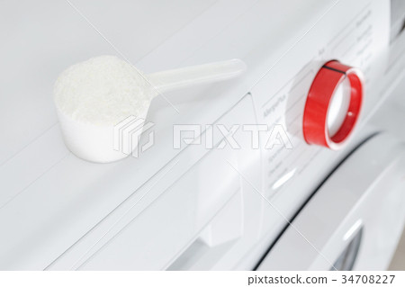 washing powder over washing machine 34708227